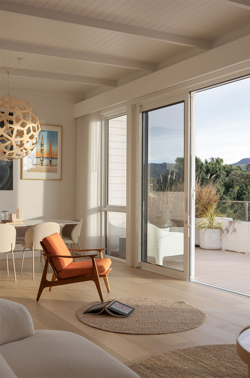 Living room with consistent light-toned finishes across walls, ceilings and joinery