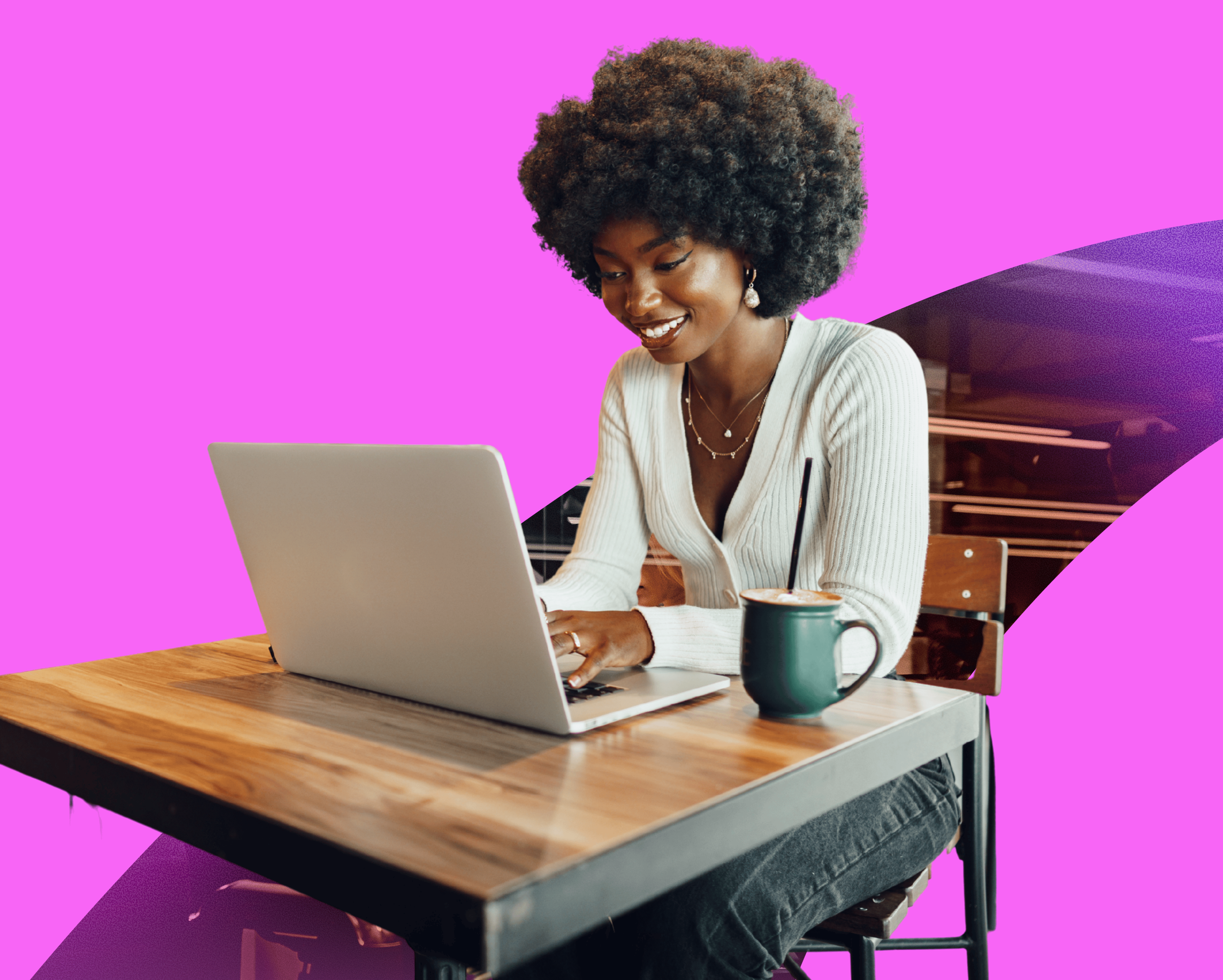 woman smiling while working on a laptop, redeeming a digital gift card from totally rewards 