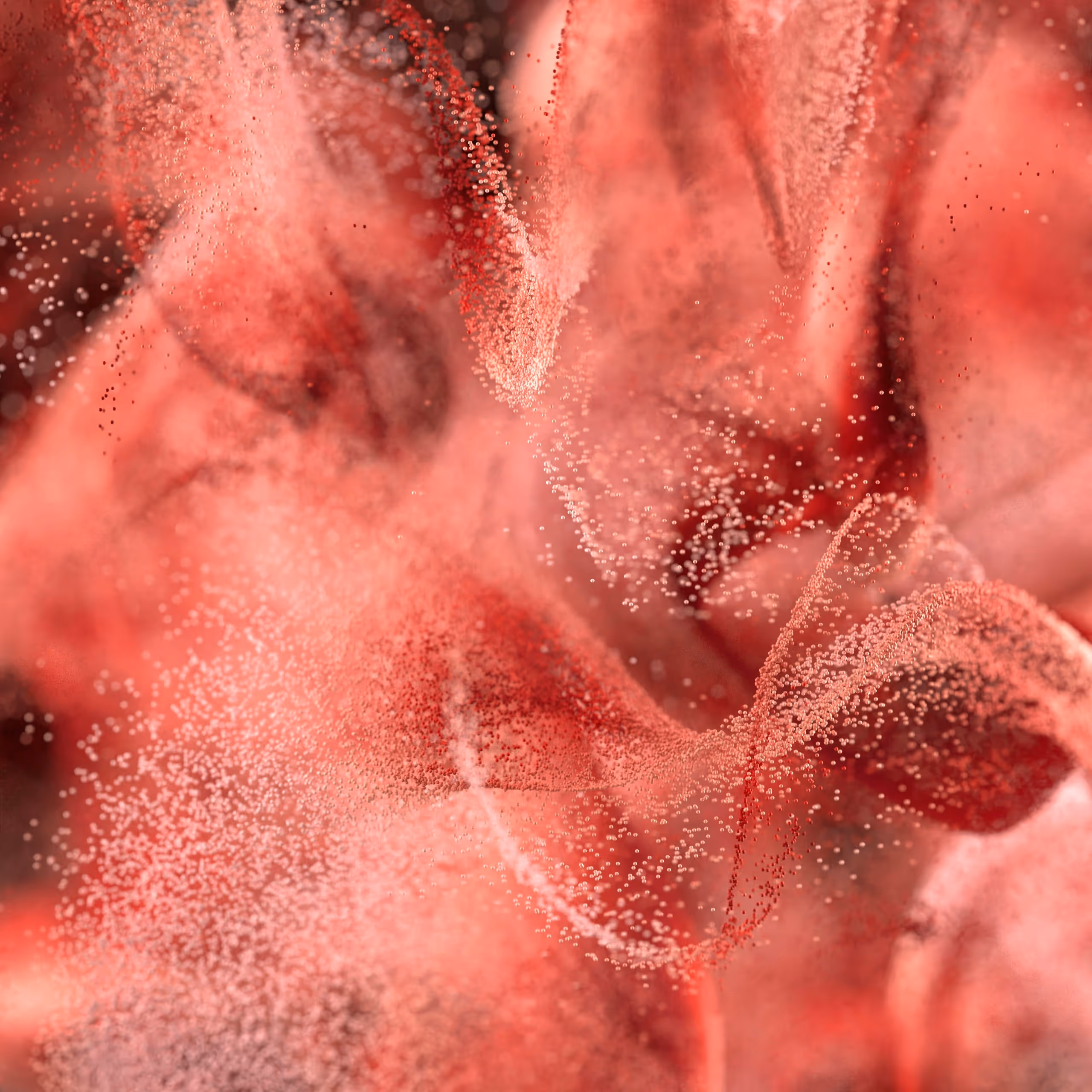 Abstract red and pink swirling particles forming soft, flowing shapes.