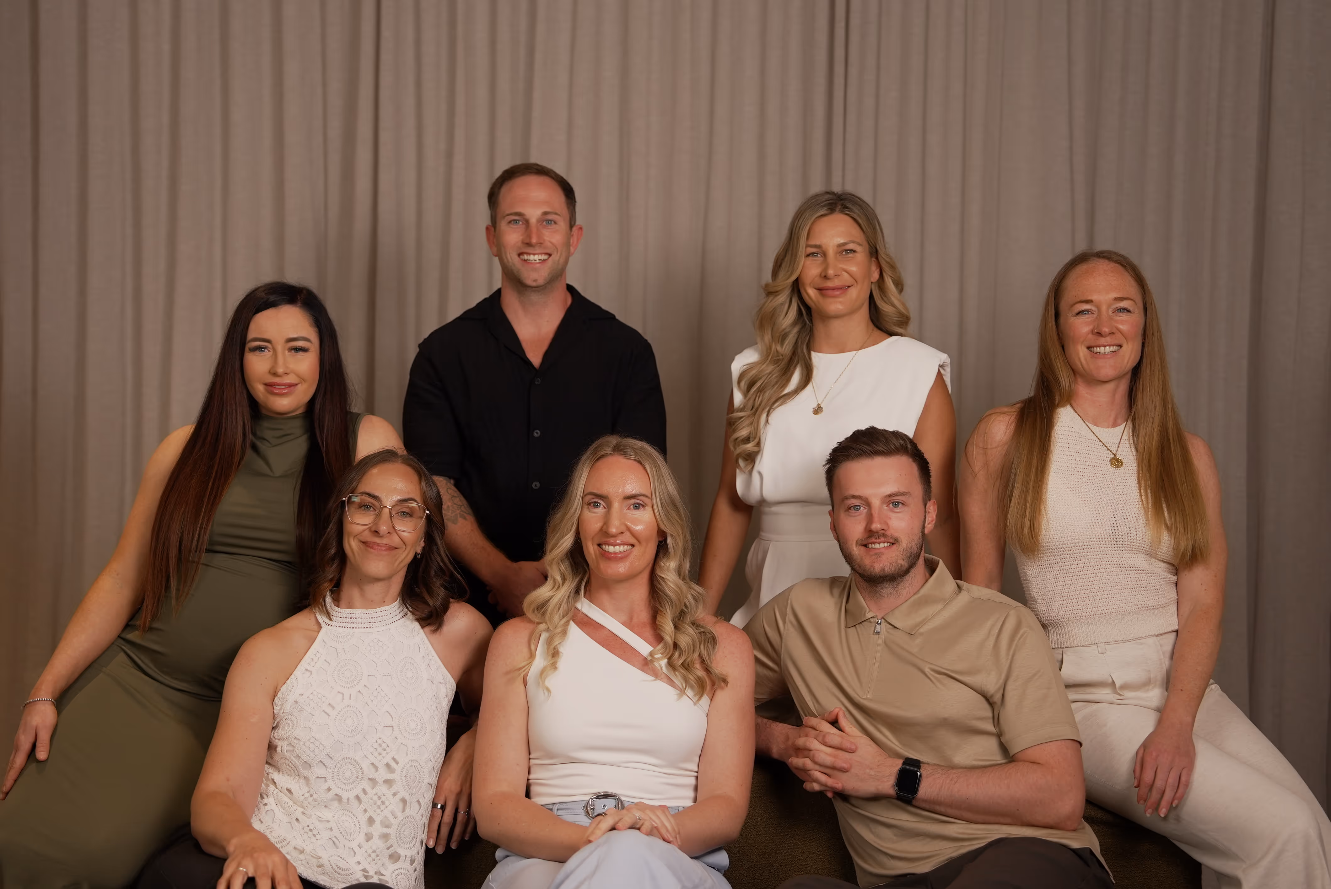 Close-up 3D illustration of a DNA double helix structure with colorful molecular particles.