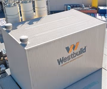 A large corrugated building roof with vents and Westbuild logo on the side.