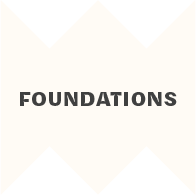 Logo with the word FOUNDATIONS centered within an X-shaped design formed by dark blue-green triangles on a white background.