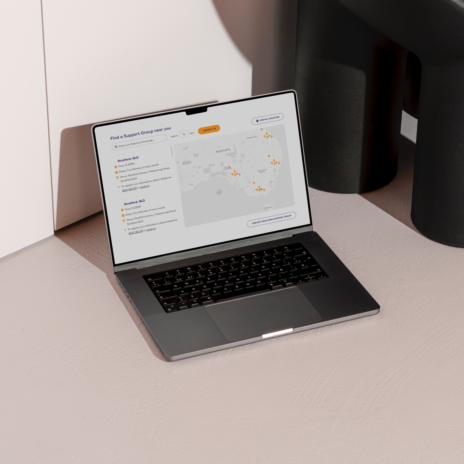 Crohn's & Colitis Australia website support group page, shown on an open laptop in a white room.