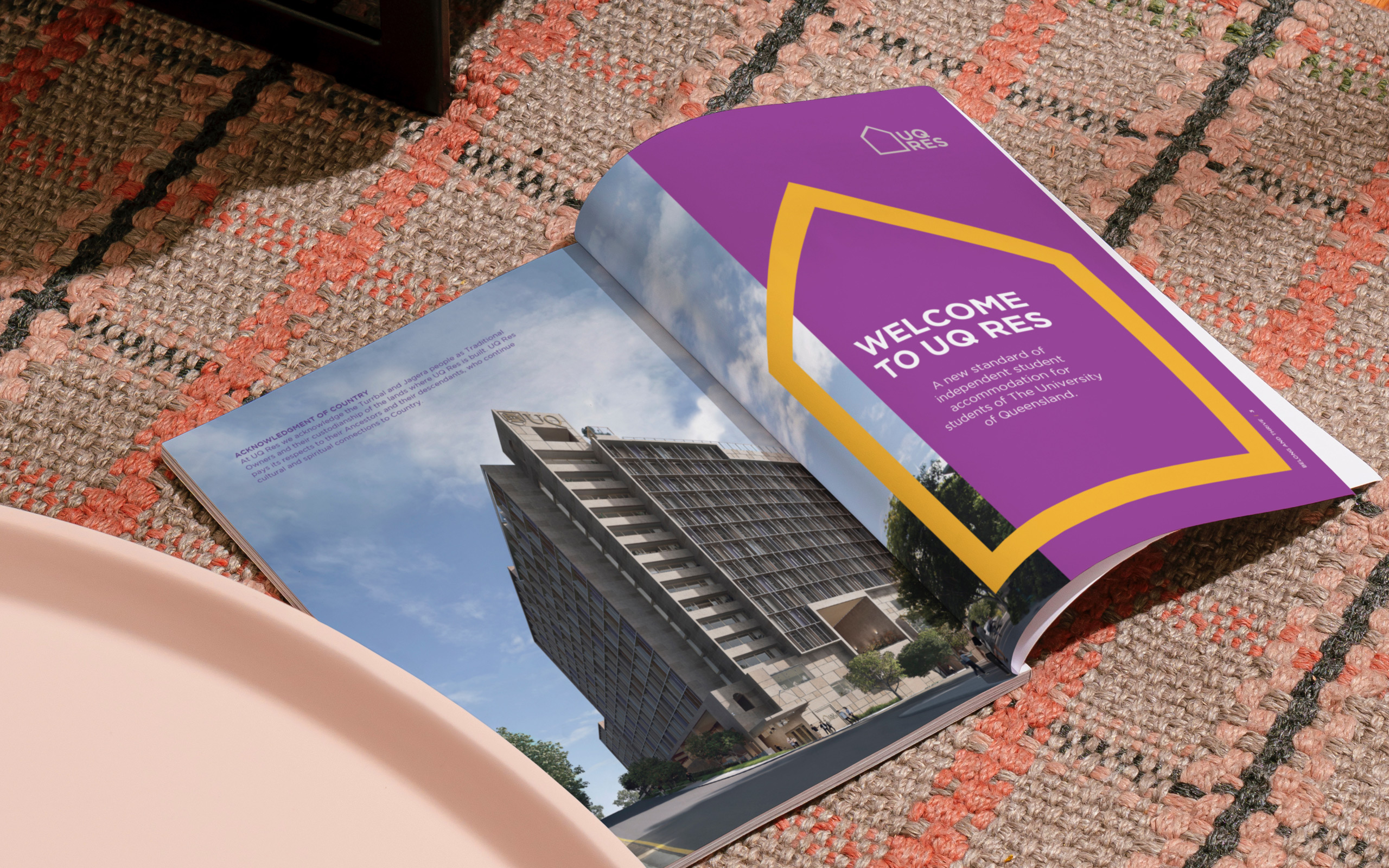 Open magazine spread showing a UQ Res building and text which reads "Welcome to UQ Res".