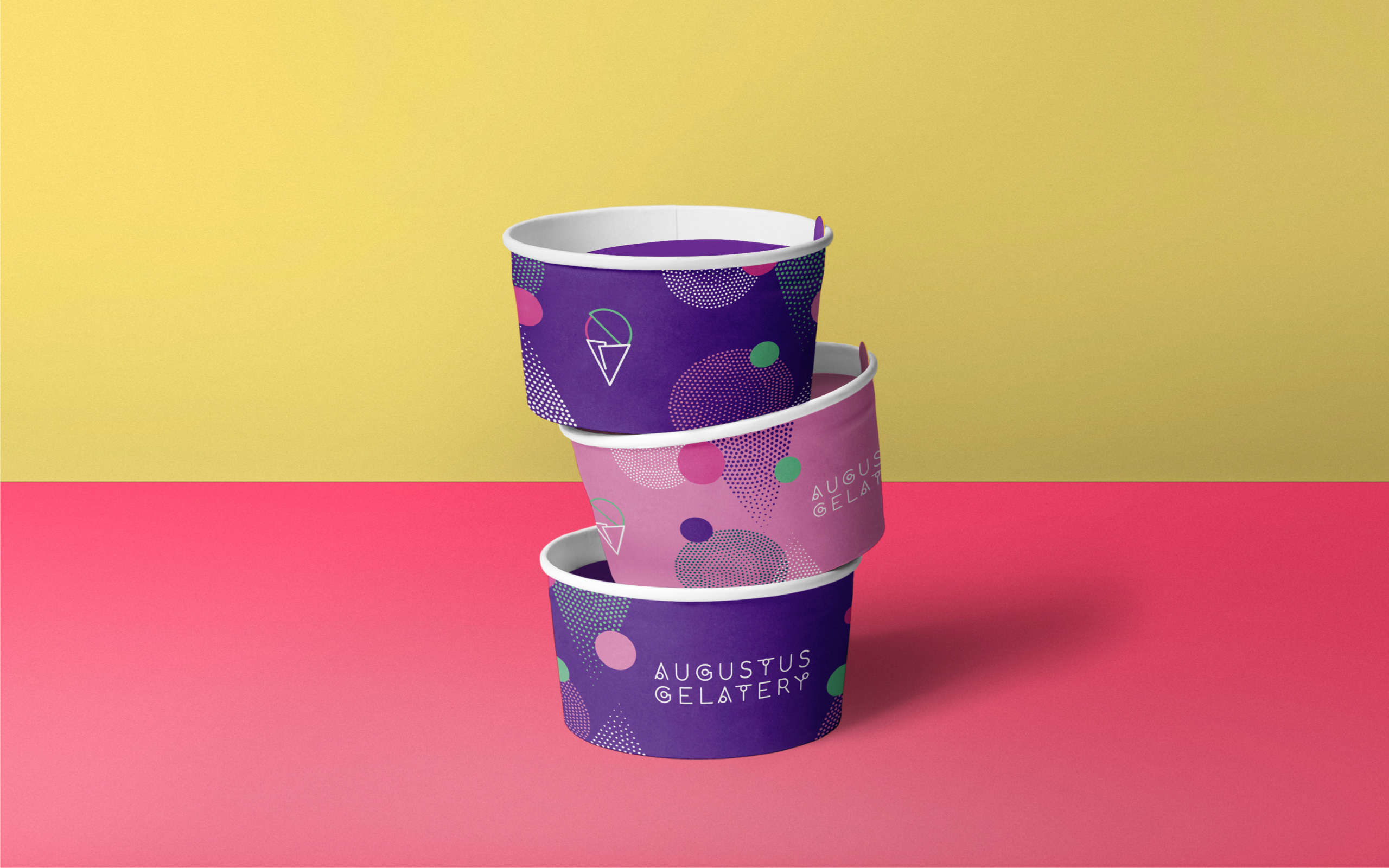 Three empty Augustus Gelatery gelato cups, stacked on top of each other.