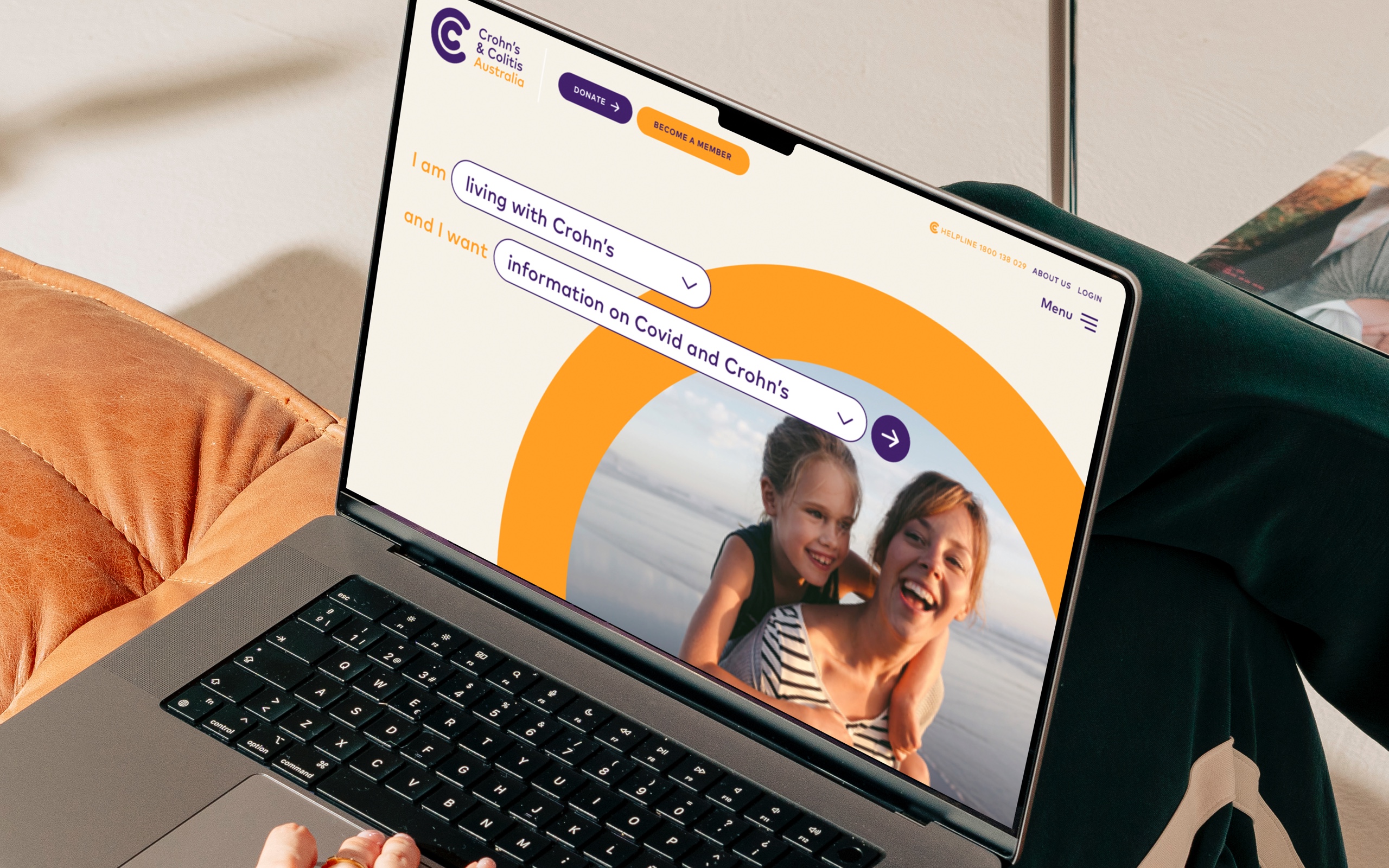 Crohn’s & Colitis Australia website shown on an open laptop in someone's lap.