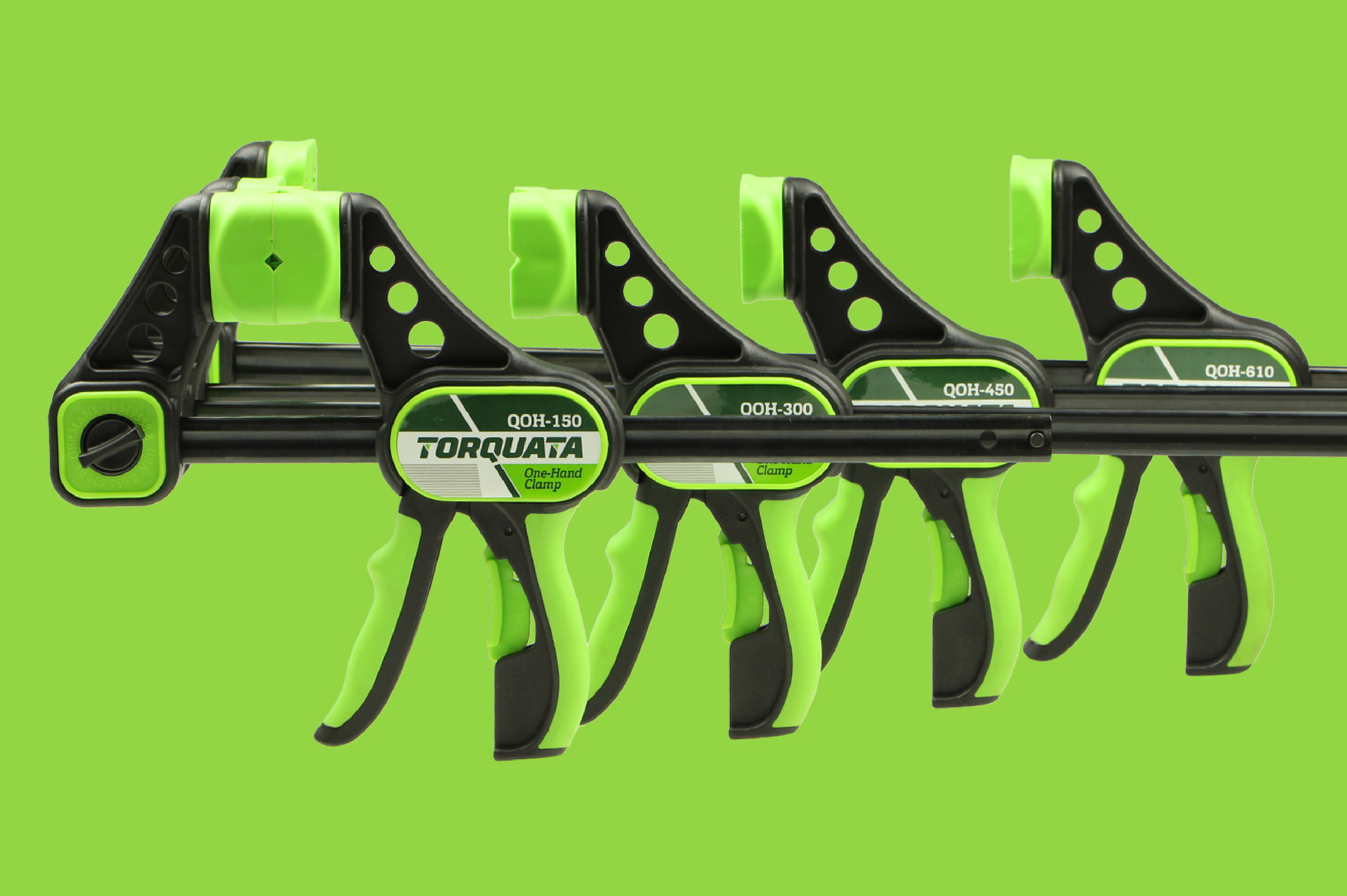 Four Torqata one-hand clamps on a bright green background.