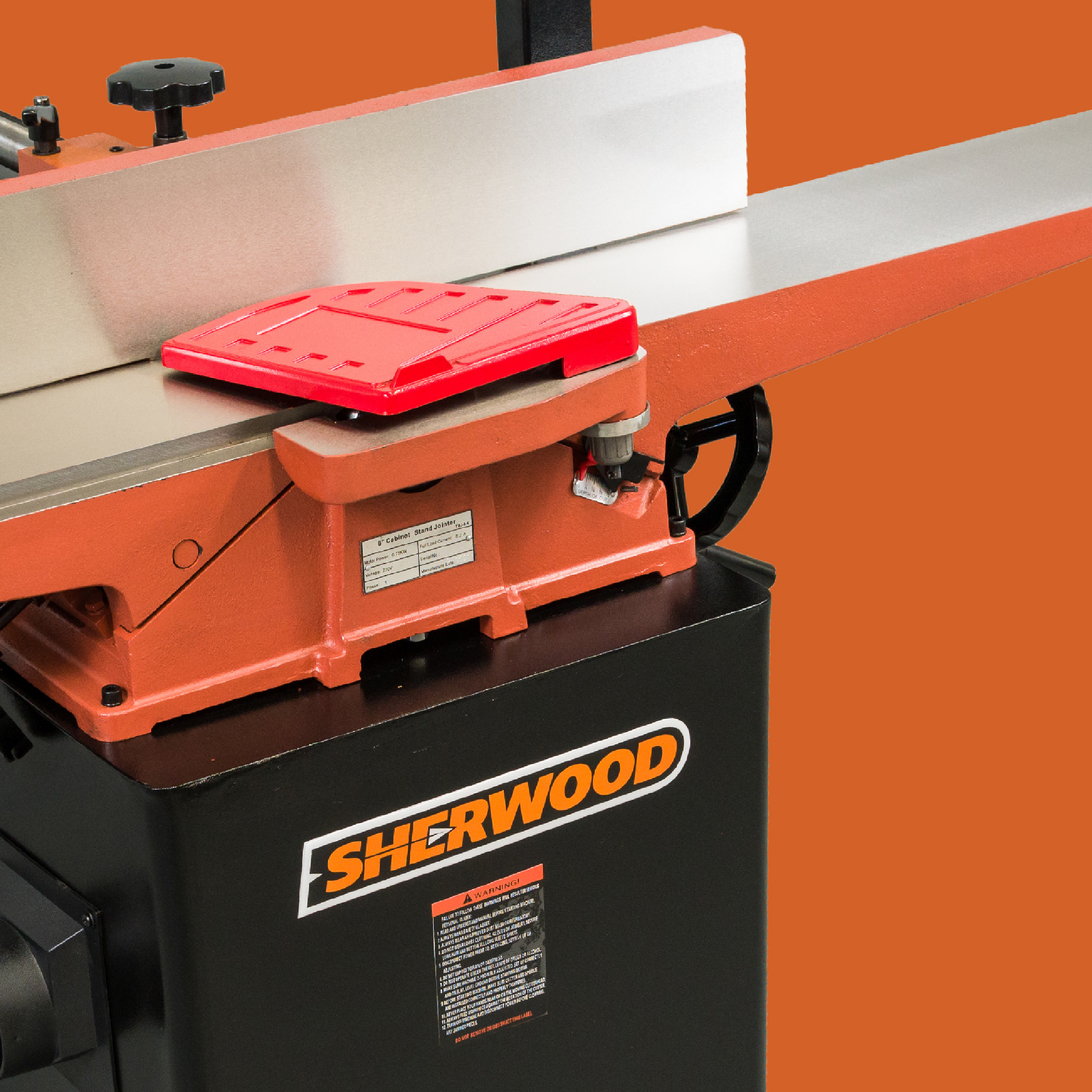 Close up of Sherwood machinery on an orange background.