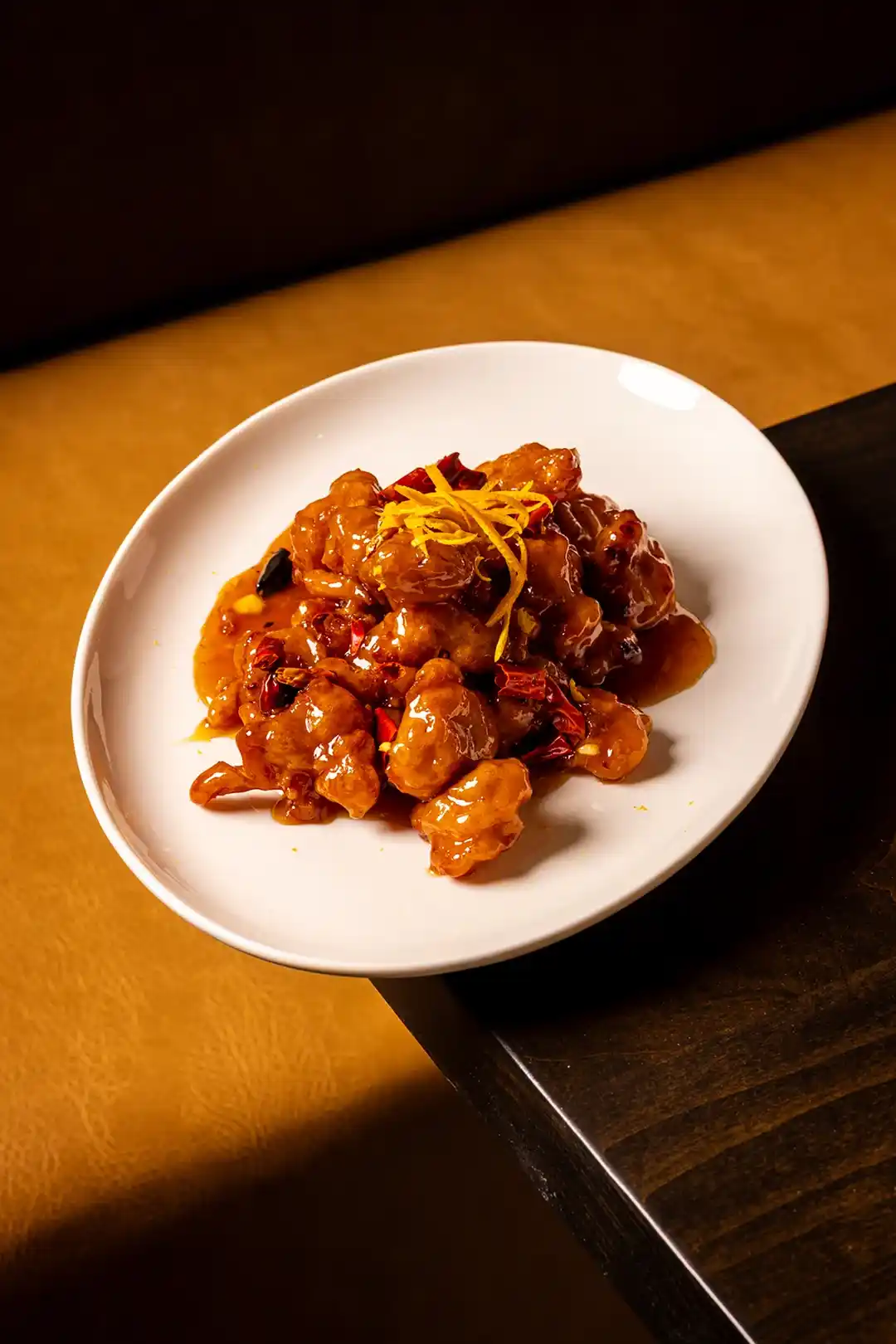 Sweet and spicy chicken glazed with Asian sauce — authentic Asian restaurant dish in San Diego.