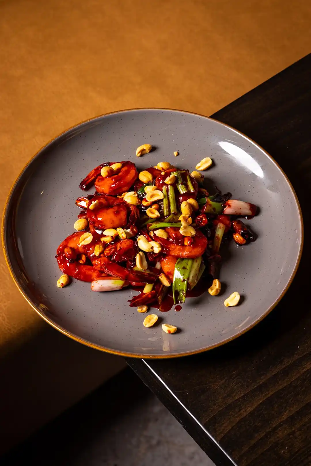 Spicy Asian shrimp stir-fry with peanuts and vegetables — signature dish at Zen Modern Asian Bistro San Diego.