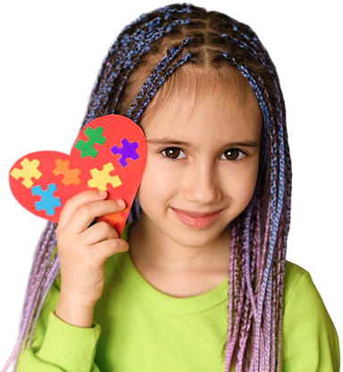 Little Girl smiling holding heart shape paper