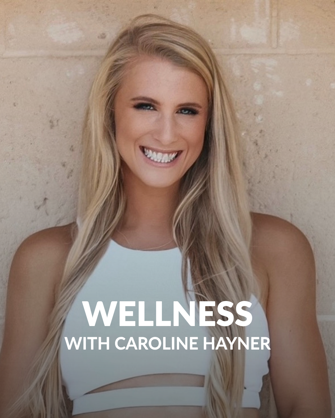 A woman wearing a white shirt smiling into the camera with text that reads "Wellness with Caroline Hayner"