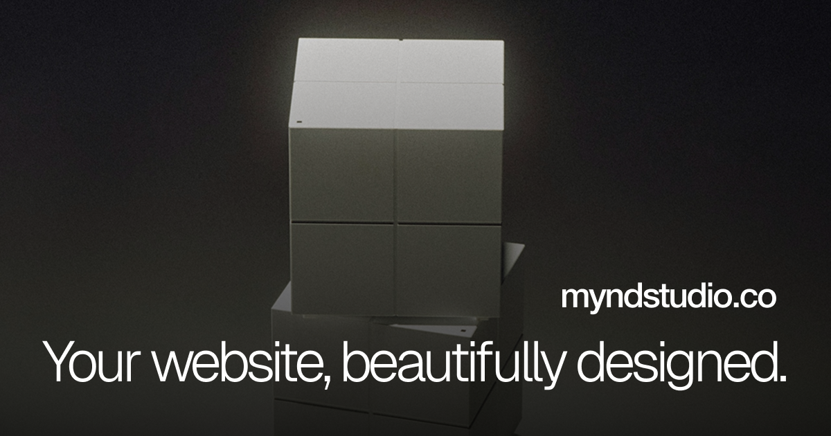 Stack of gray cubes with text 'myndstudio.co Your website, beautifully designed.' on a dark background.