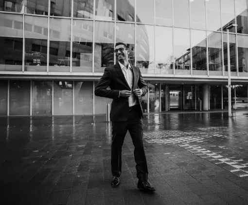 man in suit outside office building