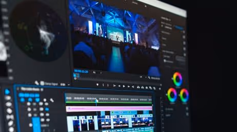 Video editing software on screen with color grading tools