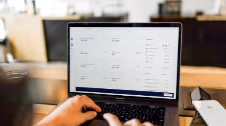 Person checking analytics dashboard on laptop screen