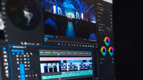 Video editing software on screen with color grading tools