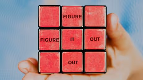 Rubik's cube with 'Figure it out' text