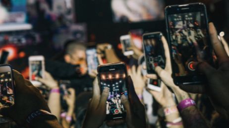 Audience recording event with smartphones in a concert