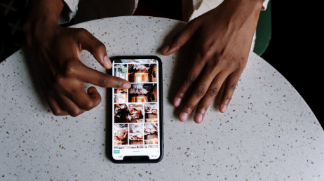 Browsing food images on mobile device at a table