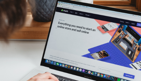 browsing Shopify website on laptop