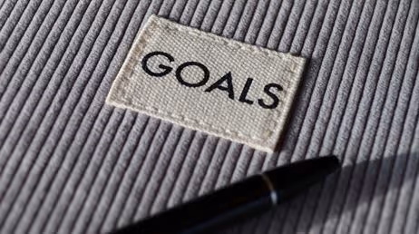 Close-up of goals patch on textured fabric with pen