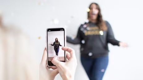 filming with smartphone in festive scene