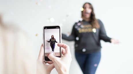 filming with smartphone in festive scene