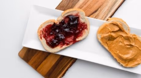 peanut butter and jelly toast on white plate