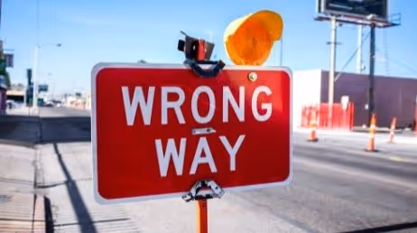 Wong way sign on the road