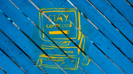 Yellow "Stay Connected" on blue wood background