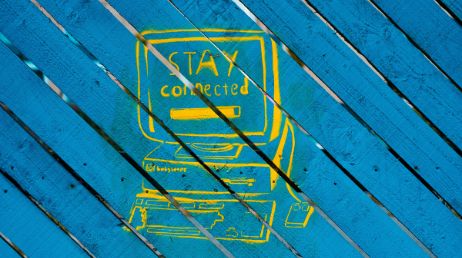 Yellow "Stay Connected" on blue wood background