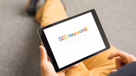 Tablet screen displaying SEO keywords search