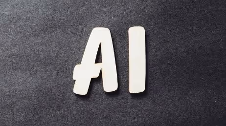 AI letters on a textured dark background