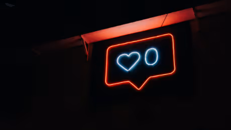 Neon sign with social media notification heart and zero likes