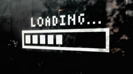 Loading screen with progress bar on a black wall