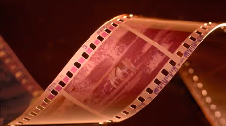 Close-up of vintage film strip on a dark background