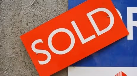 A Sold Sign Board on a wall