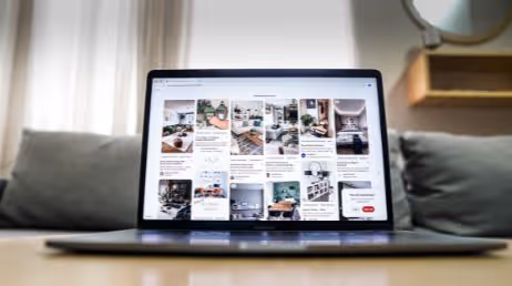 Laptop displaying Pinterest board with interior designs