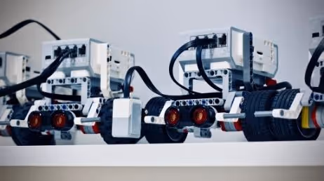 Close-up of robots lined up on a shelf