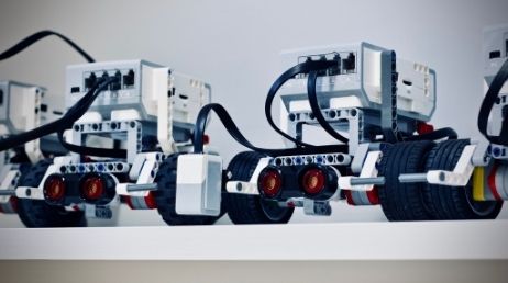 Close-up of robots lined up on a shelf