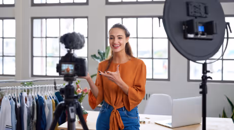 A content creator making video with camera
