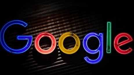 Google neon lights logo with dark background