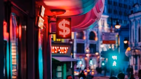 neon dolor sign board with color full background of city walk
