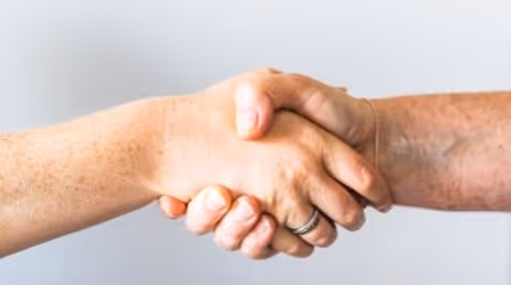 Close-up handshake symbolizing agreement or collaboration
