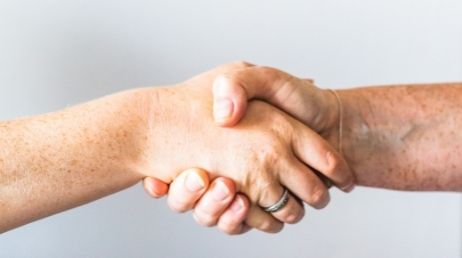 Close-up handshake symbolizing agreement or collaboration
