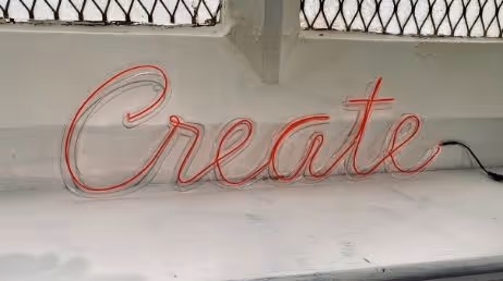 Neon sign displaying the word 'Create'