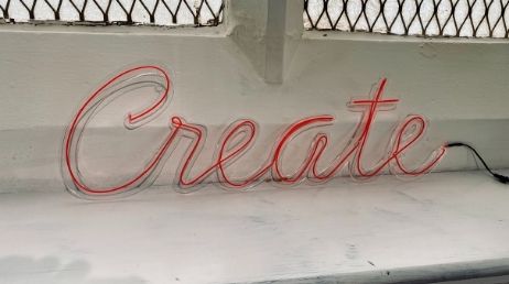 Neon sign displaying the word 'Create'