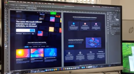 Web design project displayed on large computer screen