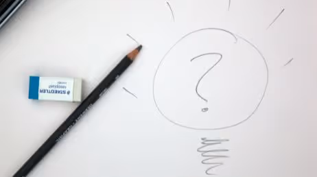 Pencil drawing of a question mark with an eraser